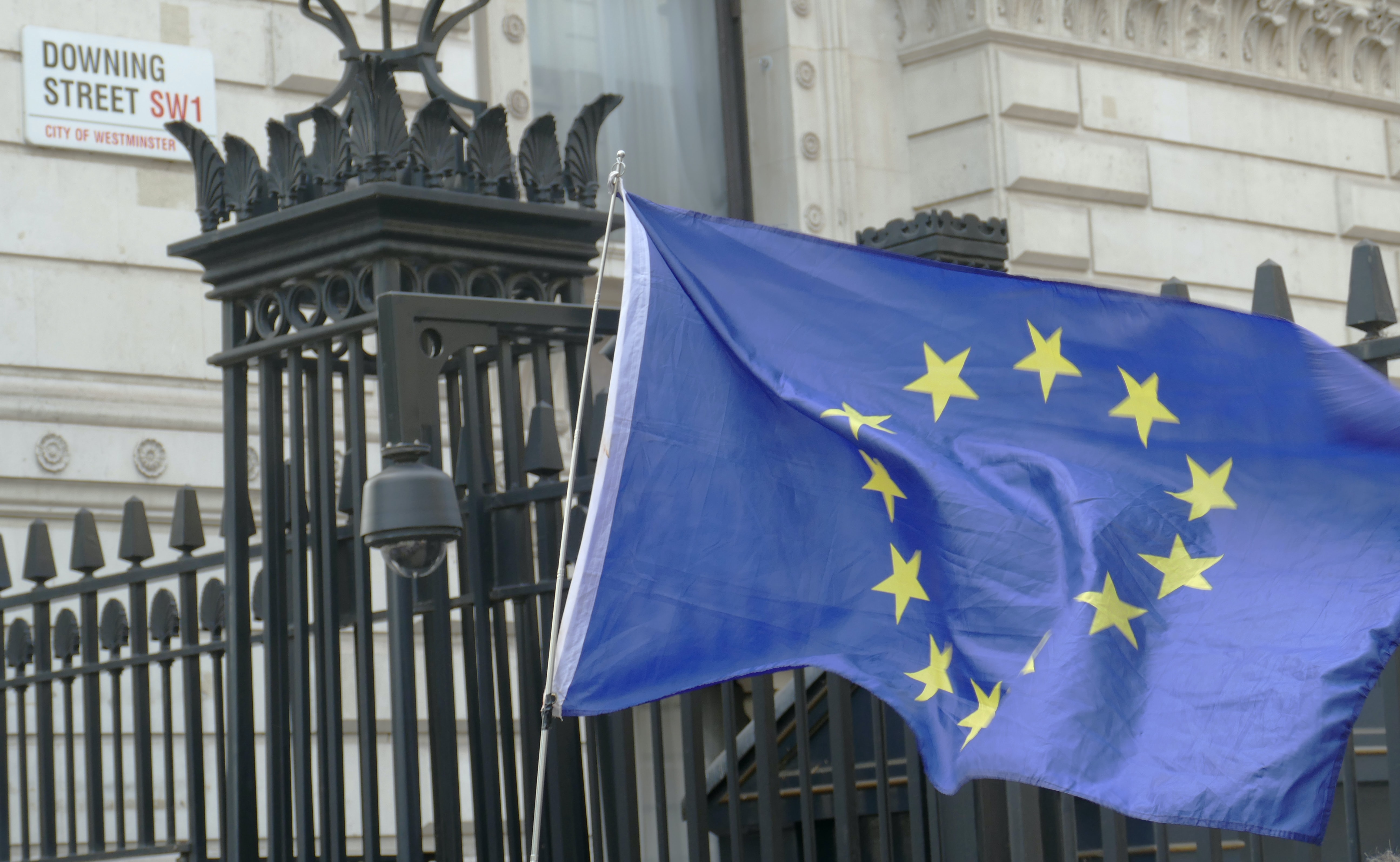 eu flag waving in the wind on downing street in london