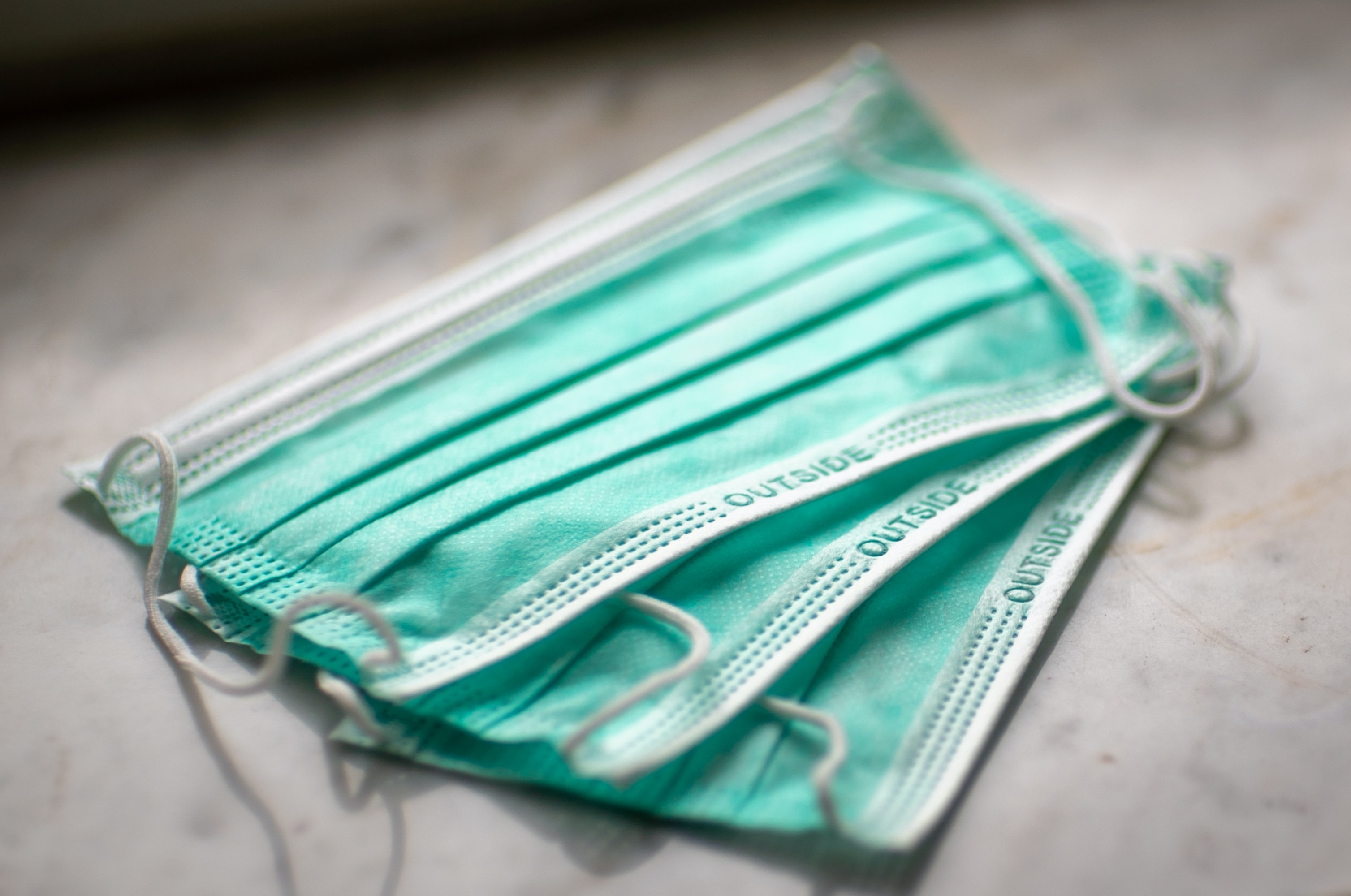 3 surgical masks on a table