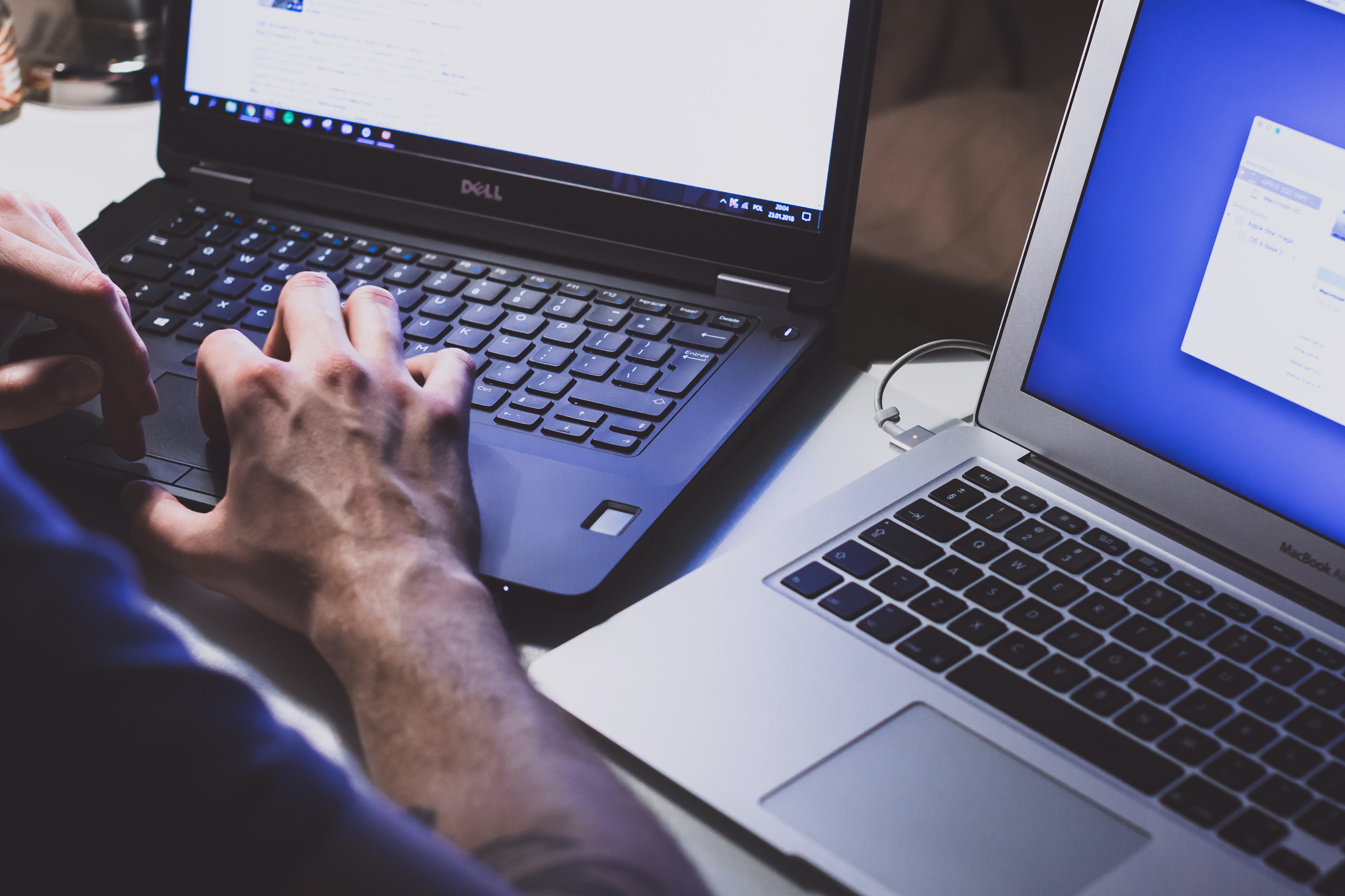 Close up of hands typing on laptop